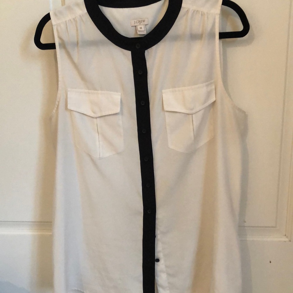 J Crew button down sleeveless blouse. Front pockets. Even hemline all around.